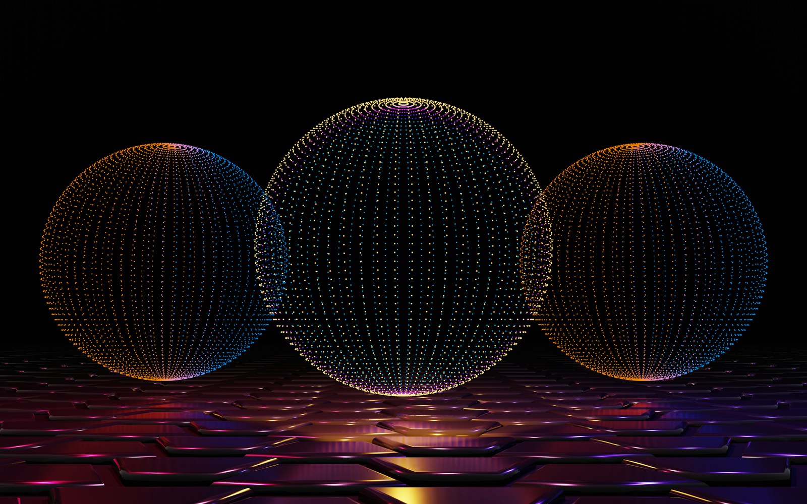 three balls of different sizes on a black background